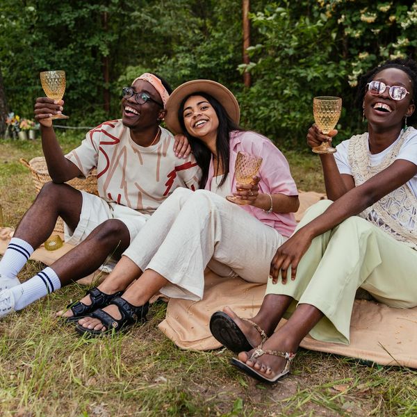 A diverse group of people of different ages smiling and looking relaxed.
